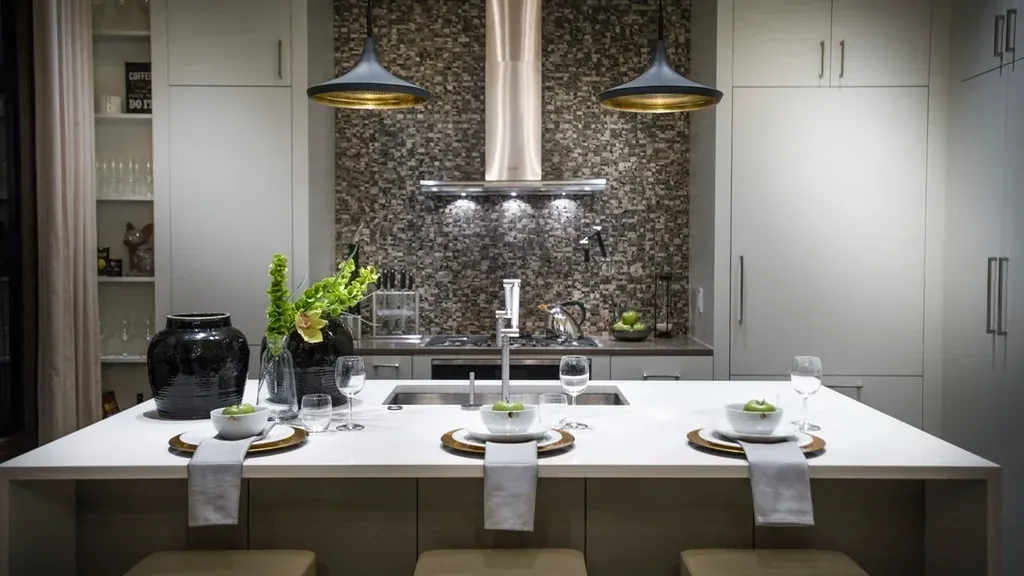 Modern kitchen with a dark central island and pendant lighting