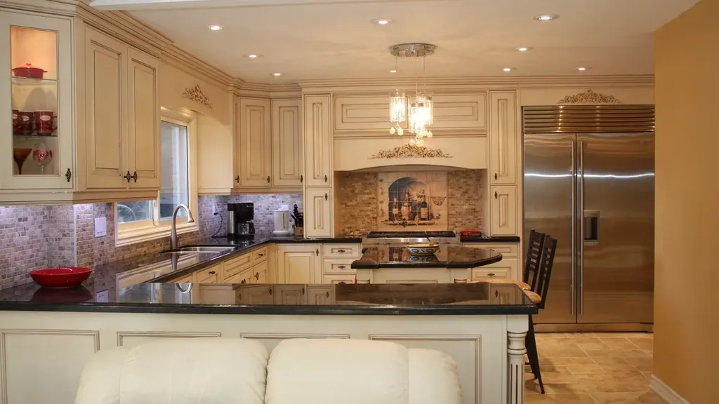 Traditional kitchen with cream cabinetry and decorative mouldings